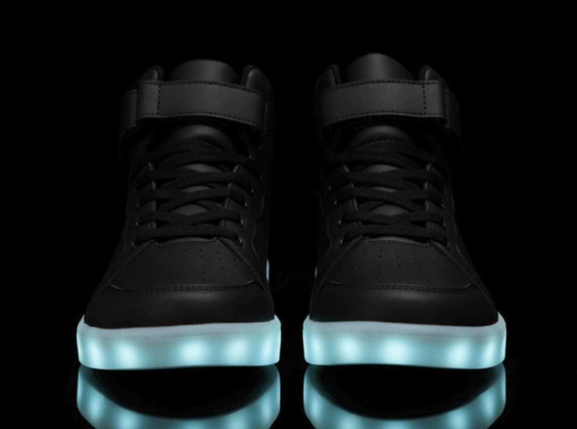 high top black led shoes striker front view